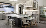 The neutral tones and open-concept design of the greenhouse kitchen