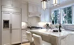new decorative tin ceiling, complemented by a perimeter countertop fabricated from Caesarstone
