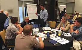 Board and volunteers discuss current trends in the marketplace. 