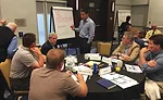 Board and volunteers discuss current trends in the marketplace. 
