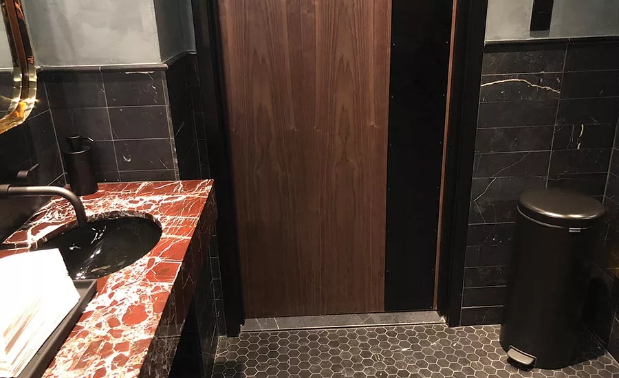 Rosso Rubino marble vanity tops and Nero Marquina marble wall tiles