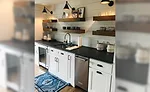 Quality Stone Concepts outputs between four to five kitchens per day