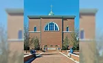 Red brick exterior accented with variegated Indiana limestone