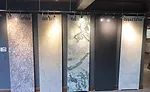 The company fabricates surfacing materials