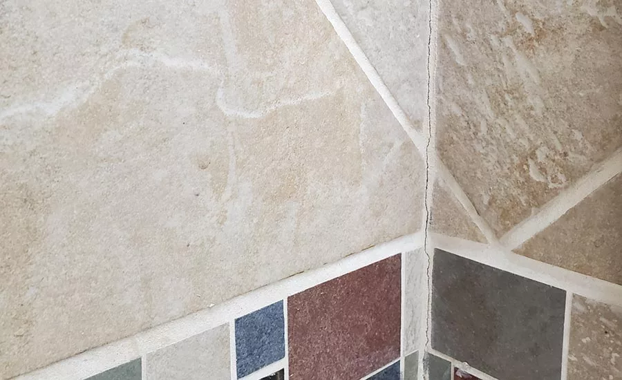 cracked grout in a shower corner