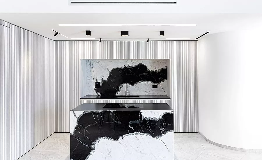Antolini Treviso: Dalmata marble creates a dramatic effect in the kitchen of an upscale apartment in Treviso, Italy.