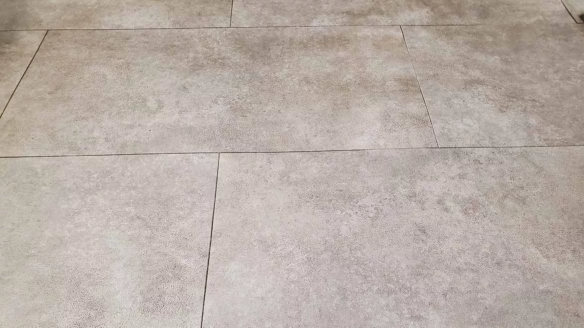 Textured light brown floor tiles