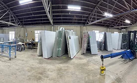  a warehouse storing large slabs of natural and engineered stone