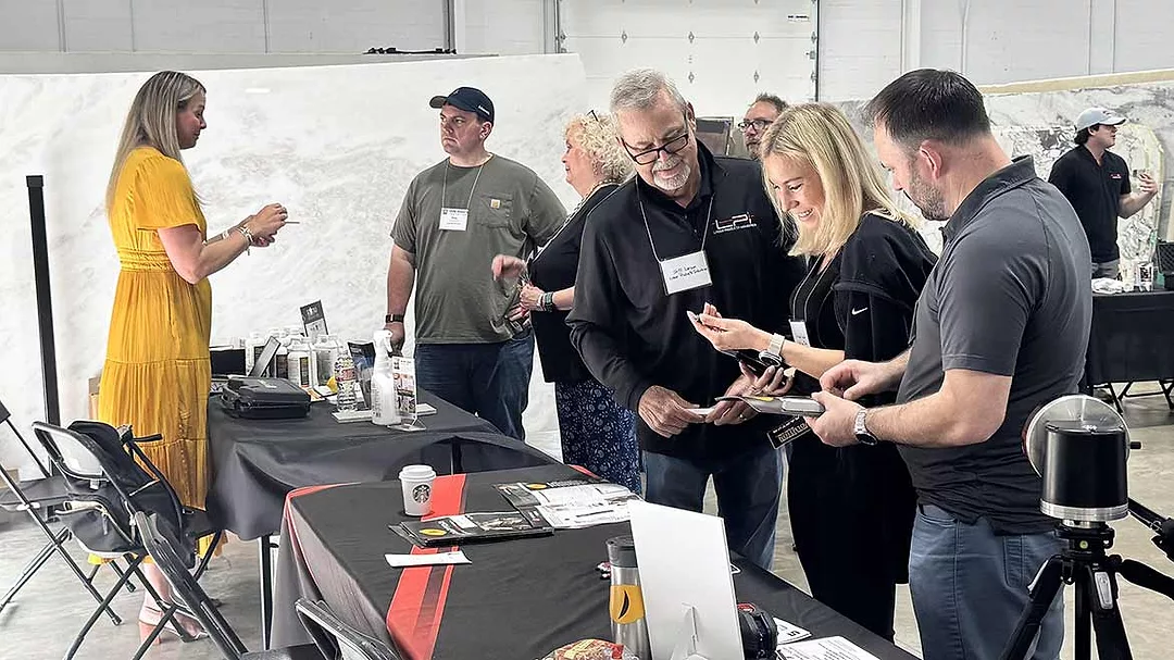 fabricators visiting with Stone Industry Education event sponsors