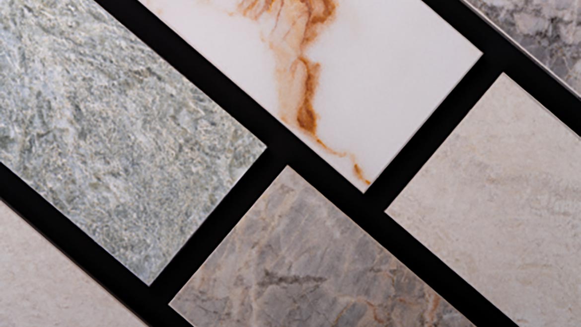 various samples of porcelain or ceramic tiles designed to mimic natural marble and stone