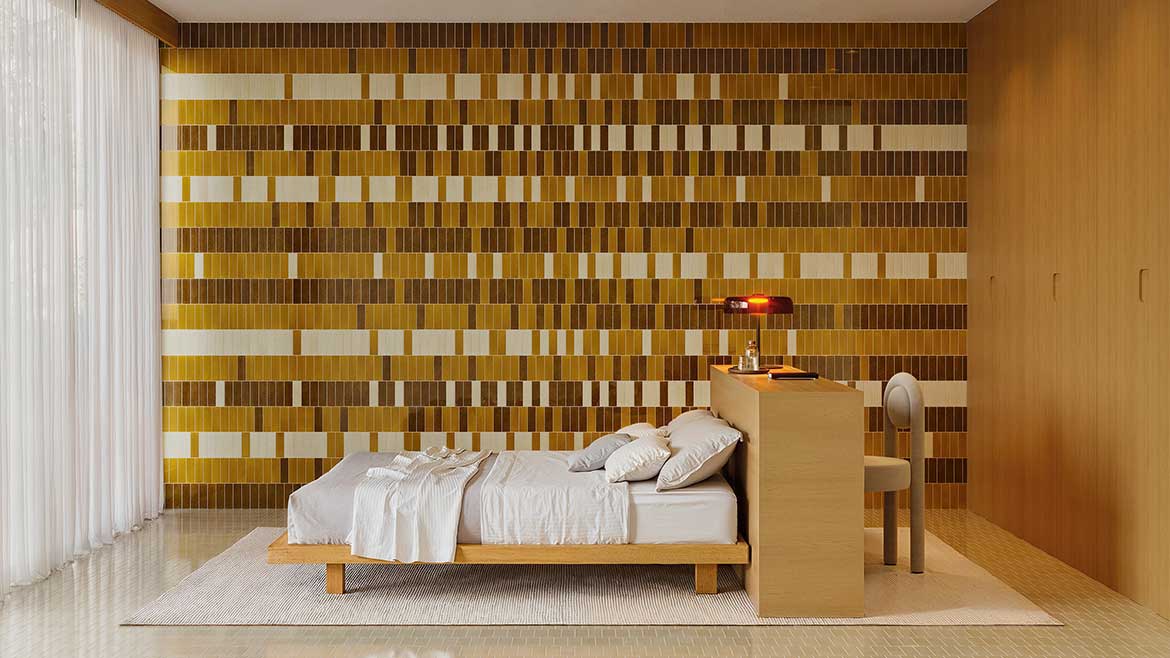 The wall features Micare collection glazed ceramic tiles by WOW Design