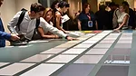 02 SW 1223 2023 Cersaie Wrap-Up Podcast. Tile laid out on a table.
