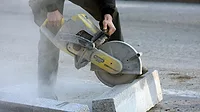 man slicing through stone man slicing through stone