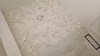 3’x4’ semi-curbless shower in a client's guest bath A 3’x4’ semi-curbless shower in a client's guest bath
